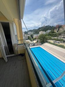 a swimming pool on the balcony of a building at Vollgaapartment2 in Durrës