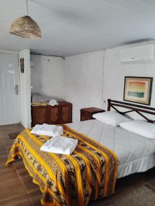 a bedroom with two beds with towels on them at Estancia serena in Guichón