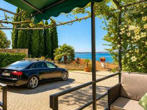 a car parked outside of a house at Apartment Gaia with private parking in Portorož