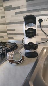 a coffee maker sitting on top of a stove at Appartamento perla in Rome +12 photos