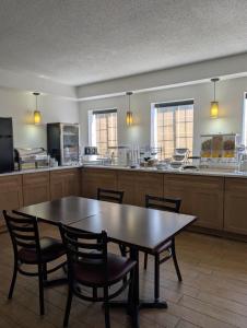 a large kitchen with a table and chairs in it at Jonestown Inn in Jonestown