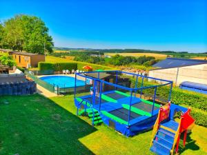 an overhead view of a playground with a pool at Beau in Houschthauser