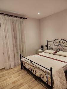 a bedroom with a large bed in a room at Civico 32 in Mondovì