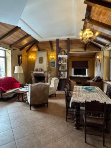 a large living room with a table and chairs at Georgios Ranch in Tsodoreti