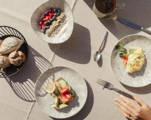 a table with four plates of food on it at My Mountain Moments - Adults Only 12 plus in Selva dei Molini