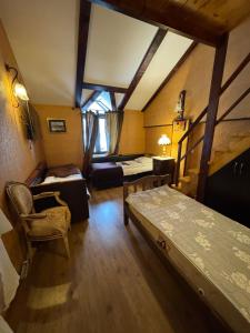 a room with two beds and a chair in it at Georgios Ranch in Tsodoreti