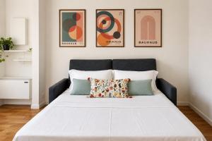 a bedroom with a large white bed with two pillows at GiaxTower Gym Spa & Pool Romantic Pool View in Milan