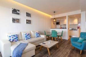 a living room with a couch and chairs and a table at Monumental Apartments - Multi Listing in Funchal