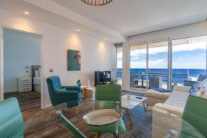 a living room with a view of the ocean at Monumental Apartments - Multi Listing in Funchal
