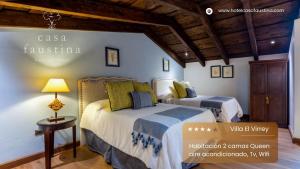 a bedroom with two beds in a room at Casa Faustina Boutique Hotel in Antigua Guatemala