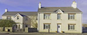 a large white house with a black roof at Slievebawn Accommodation in Sligo