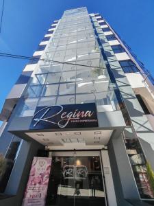 a building with a sign on the side of it at Loft de 2 Camas in Callampaya