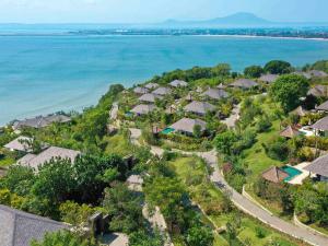 an aerial view of a resort near the water at Raffles Bali in Jimbaran