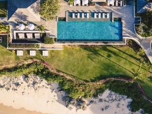 an aerial view of a house with a swimming pool at Raffles Bali in Jimbaran