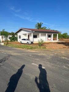 two shadows of a man and a car on a street at Casa playa el Retén 