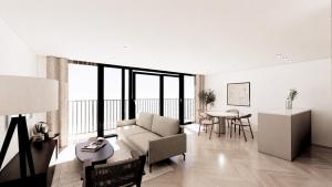 a living room with a couch and a table at Lakeside Studios Konstanz in Konstanz