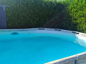 a large swimming pool with blue water at Loft Pietrasanta in Pietrasanta