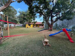 a park with a playground with a toy at Casinha Rústica in Indaiatuba