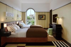 a large bedroom with two beds and a window at The Warbler in New Orleans