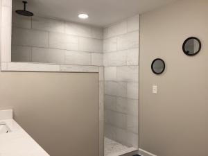 a bathroom with a shower with a glass door at Pickwick Dreams in Counce