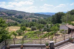 a view of a garden with a fence at Casa Experience - Acri in Calamia