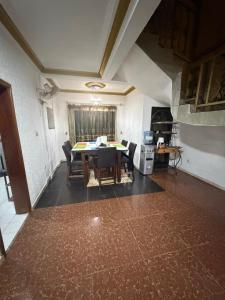 a living room with a dining room table and chairs at Abbe Residence in Bamako +12 photos