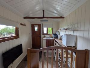 a small kitchen with a counter and a microwave at The Willows in Scarisbrick