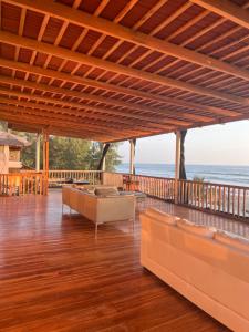 a living room with a view of the ocean at Aloha.ayampe in Ayampe