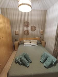 a bedroom with a bed with two pillows on it at El DESAFÍO in Riópar
