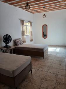 a bedroom with two beds in a room at Casa Progresso in Juiz de Fora