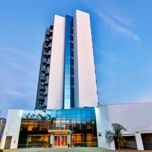 a tall building with a lot of windows at Hotel Amsterdam Montes Claros in Montes Claros
