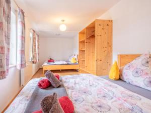 a bedroom with a bed and a bunk bed at Kraftplatz am Litzlhof in Itter