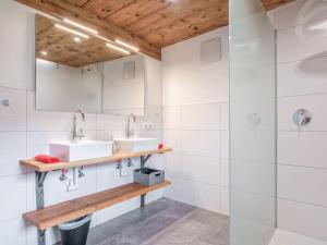 a bathroom with two sinks and a shower at Kraftplatz am Litzlhof in Itter +34 photos