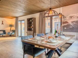 a dining room with a table and chairs at Gerlitzen Seealm in Afritz