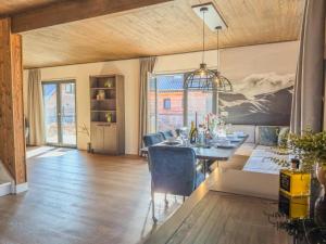 a dining room with a table and chairs at am Afritzer See in Afritz