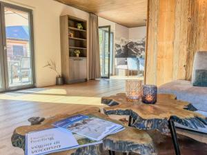 a living room with a table and a couch at am Afritzer See in Afritz +33 photos