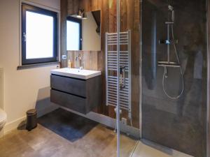a bathroom with a sink and a shower at Bergblick am Afritzer See in Afritz +19 photos
