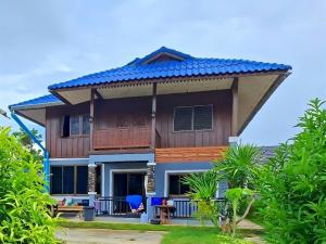 a house with a large roof at Tasowa House in Chiang Rai