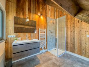 a bathroom with a sink and a shower at Alpenchalet am See in Afritz +33 photos