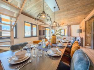 a dining room with a large wooden table and chairs at Afritz am See in Afritz