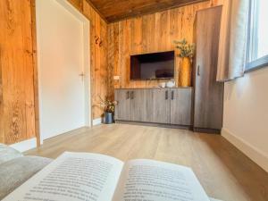 an open book sitting on a bed in a room at Verditzblick in Afritz