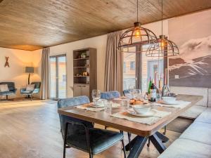 a dining room with a table and chairs at Alpenchalet Afritz am See in Afritz