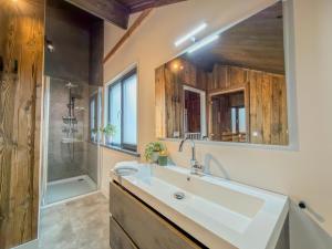 a bathroom with a sink and a shower at Alpenchalet Afritz am See in Afritz
