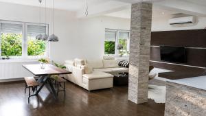 a living room with a couch and a table at NOVA residence in Sarajevo