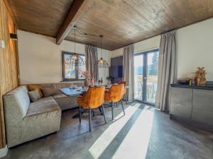 a living room with a couch and a table at Berg und See in Afritz