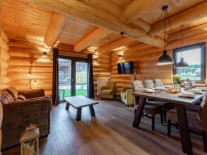 a living room with a table in a log cabin at Jenig 2B in Jenig