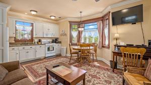 a kitchen and living room with a table and chairs at Lewis Loft by AvantStay in Paso Robles