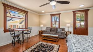 a bedroom with a bed and a couch and a table at Lewis Loft by AvantStay in Paso Robles