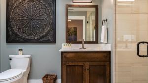 a bathroom with a sink and a mirror at Paso Park Suites by AvantStay in Paso Robles +16 photos