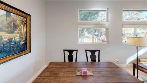 a dining room with a wooden table and a painting at Twice is Nice by AvantStay in Paso Robles +5 photos